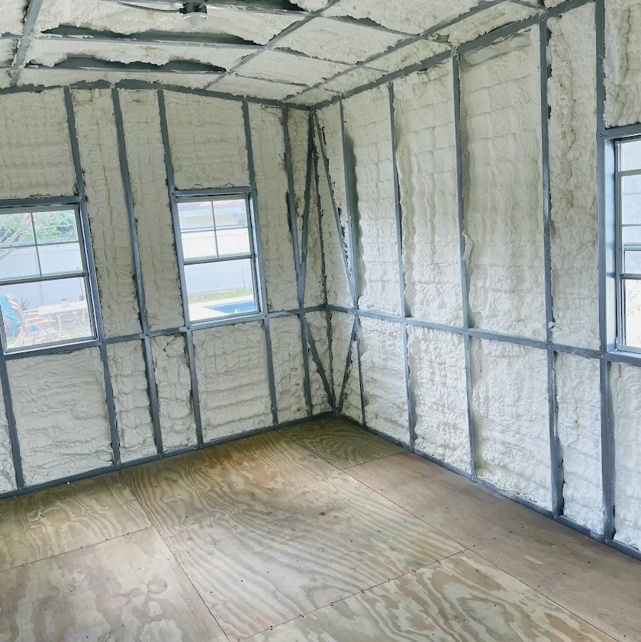 Closed-cell spray foam insulation applied to wall cavities in a residential project in Yeadon